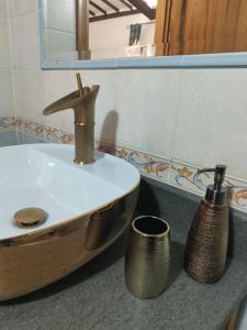 a bathroom with a sink and a mirror and a sink at Agriturismo Le Vigne in Bolsena