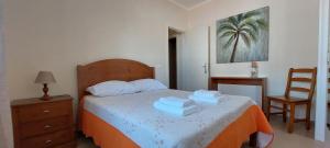 En eller flere senge i et værelse på Casa Penedo do Forno