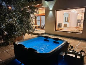 a jacuzzi tub in a backyard with a house at Greenscape Village in Ulcinj