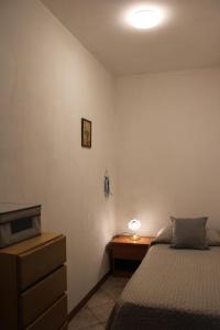 a bedroom with a bed and a desk with a lamp at La Pesciatina in Pescia +14 photos