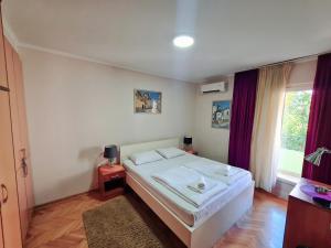 Krevet ili kreveti u jedinici u okviru objekta Apartments Pier