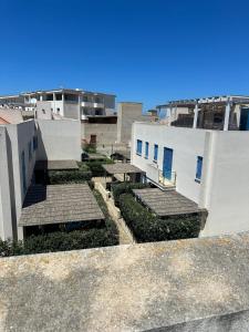 a view of a building with stairs and plants at Favignana Holidays in Favignana