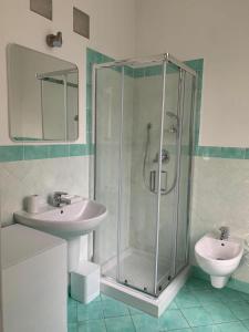 a bathroom with a shower and a sink at Son Sogni Holiday House in Leggiuno +10 photos