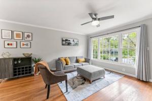 a living room with a couch and a chair at Picture-Perfect Charmer in North Decatur in Decatur