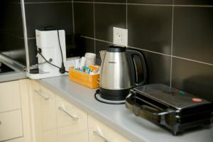 a coffee maker on a counter in a kitchen at Casa di Besarb in Shkodër