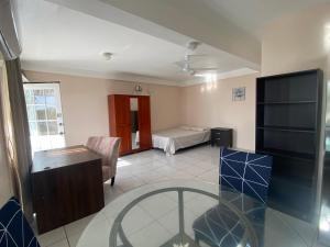 Postel nebo postele na pokoji v ubytování Green Flash Apartments