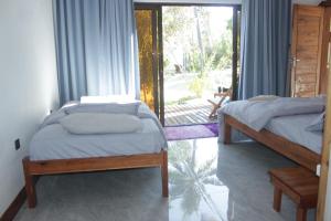 Letto o letti in una camera di CosyBe Villas
