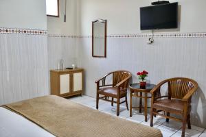 TV o dispositivi per l'intrattenimento presso Garuda Setia Hotel