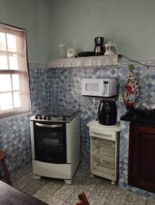 Dapur atau dapur kecil di Apartamento Aconchegante