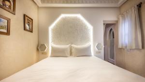 Voodi või voodid majutusasutuse Luxe Nomade Marrakech & Spa toas