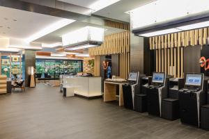a store with several cash registers in a lobby at Cross Hotel Kyoto in Kyoto