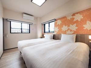 HIYORI Stay Kyoto Kamogawa客房内的一张或多张床位