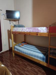 Ein Bett oder Betten in einem Zimmer der Unterkunft Hostel el Amanecer