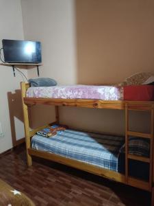 Ein Bett oder Betten in einem Zimmer der Unterkunft Hostel el Amanecer