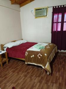 Ein Bett oder Betten in einem Zimmer der Unterkunft Hostel el Amanecer