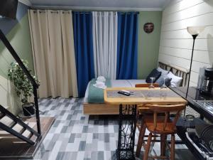 a room with a bed and a table and chairs at Kahel in Fortuna