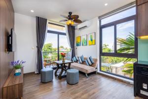 TV a/nebo společenská místnost v ubytování Hai Hội Villa Hoi An
