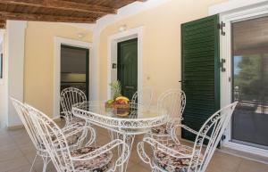 a dining room with a glass table and chairs at Korfoula Residence - Peaceful retreat in Zante in Koiliomenos +14 photos