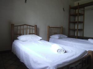 Säng eller sängar i ett rum på Fazenda Mogiquiçaba