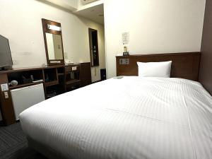 Postel nebo postele na pokoji v ubytování Hotel Route-Inn Yaizu Inter