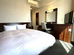 Postel nebo postele na pokoji v ubytování Hotel Route-Inn Yaizu Inter