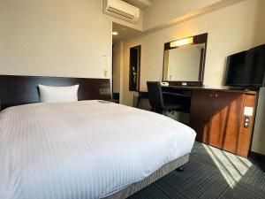 Postel nebo postele na pokoji v ubytování Hotel Route-Inn Yaizu Inter