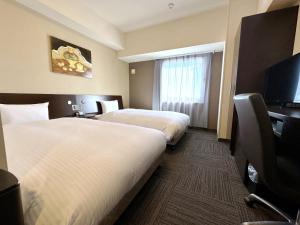 TV a/nebo společenská místnost v ubytování Hotel Route-Inn Yaizu Inter