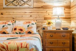 a bedroom with a bed and a lamp on a night stand at Nature's View Retreat Serenity and Splendor in Hollister