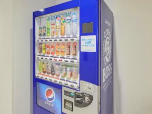 a vending machine filled with bottles of soda at 2-51 Miyamaecho - Hotel / Vacation STAY 8653 in Kumagaya