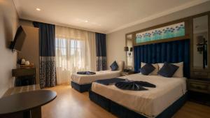 Postel nebo postele na pokoji v ubytování Farina Hotel By Cigno