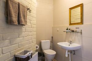 a bathroom with a toilet and a sink at Centrum Turystyki Niekonwencjonalnej in Srebrna Góra +51 photos