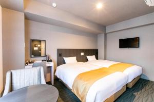 Katil atau katil-katil dalam bilik di Hotel Wing International Shimbashi Onarimon