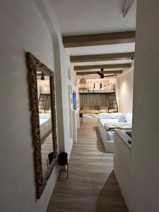 a room with two beds and a mirror on the wall at The Boho House in Ujjain