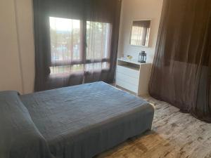a bedroom with a bed and a large window at Villa Espiga in Benalmádena +11 photos