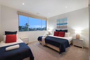 Ένα ή περισσότερα κρεβάτια σε δωμάτιο στο Opulence on Broadbeach