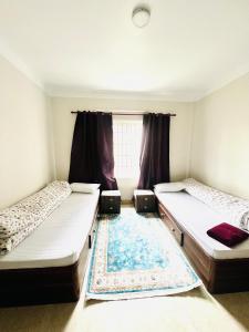 Postel nebo postele na pokoji v ubytování Muma Home Stay