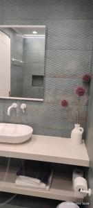 a bathroom with a sink and a mirror at Livadi Apartments in Plakias +134 photos