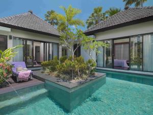 a villa with a pool and a house at The Ayu Kintamani Villa at Toya Devasya in Kintamani