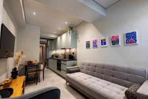 a living room with a couch and a table at Evlalia home in Zakynthos