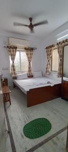 Postel nebo postele na pokoji v ubytování Regencyy Guest House
