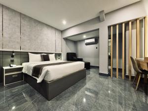 Postel nebo postele na pokoji v ubytování LION 9 HOTEL