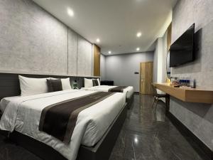 Postel nebo postele na pokoji v ubytování LION 9 HOTEL