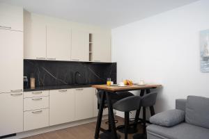 Kuchyň nebo kuchyňský kout v ubytování Dario Residence B + 13 fotografií