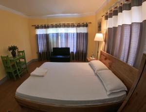 Letto o letti in una camera di DRAKON NEST HOMESTAY