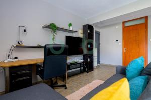 Телевизор и/или развлекательный центр в Seaside Apartment