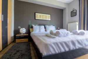 Кровать или кровати в номере Seaside Apartment