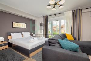 Кровать или кровати в номере Seaside Apartment