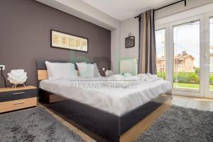 Кровать или кровати в номере Seaside Apartment