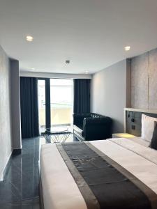 Postel nebo postele na pokoji v ubytování LION 9 HOTEL
