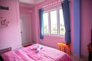 Rúm í herbergi á Bảo Dung Hotel